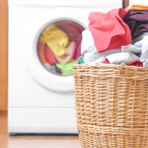 Laundry basket on the background of the washing machine.; Shutterstock ID 375472924; PO: today.com